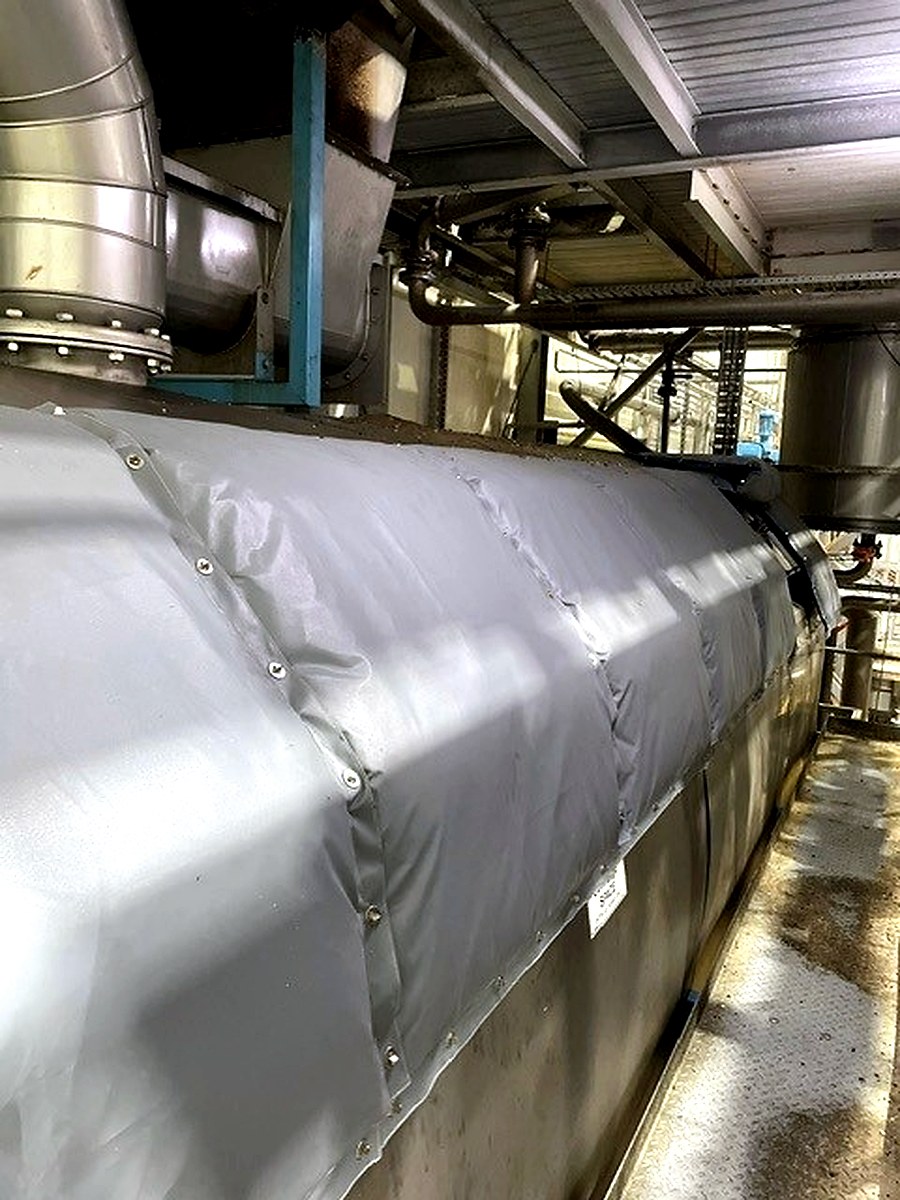 Large panel-style thermal jacket fitted along the length of a large industrial vessel or tank